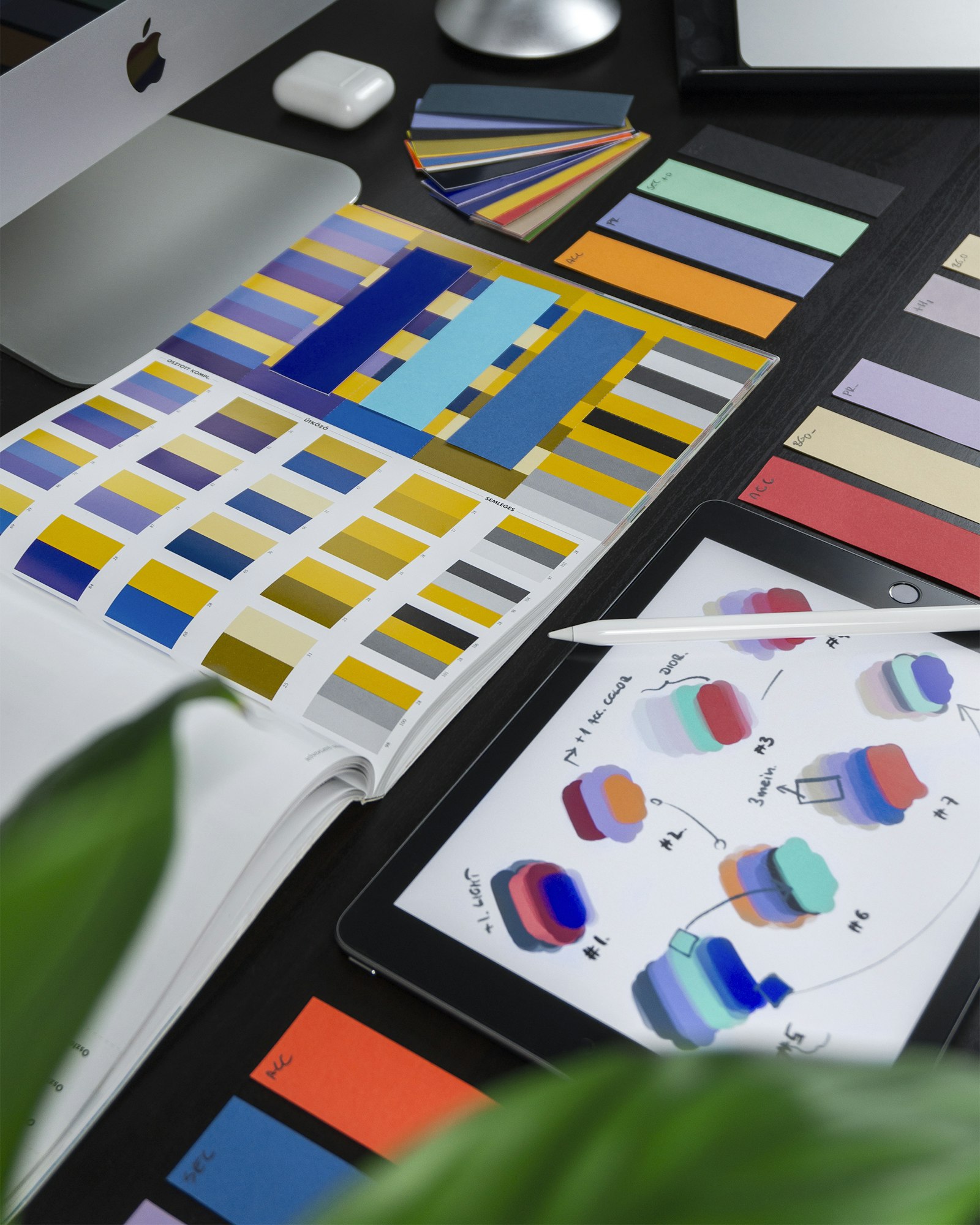 Tablet with UI design mockups on desk — UAE UI product, .ae tech brandable