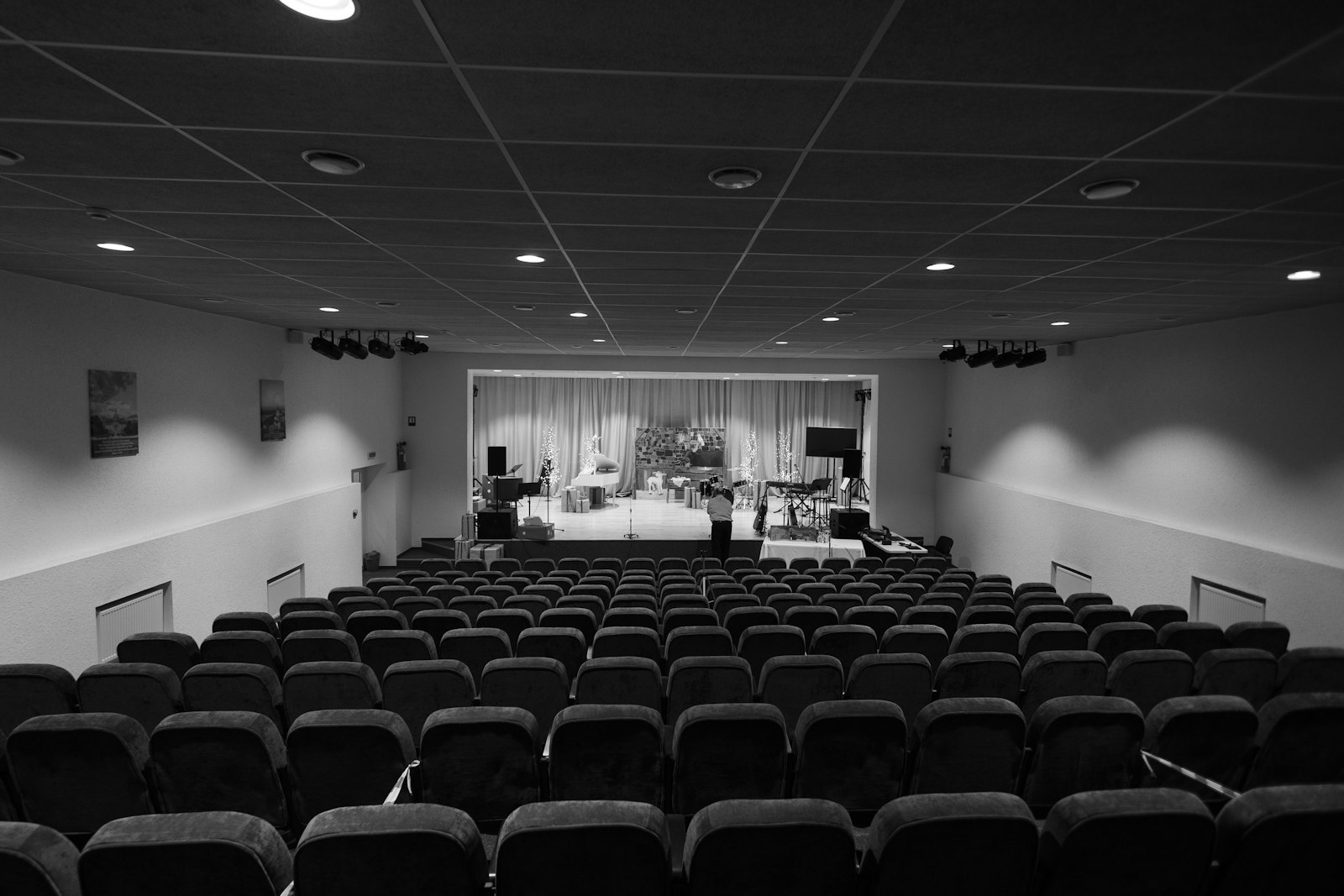 Empty theater auditorium with stage and soft seating — entertainment brandable
